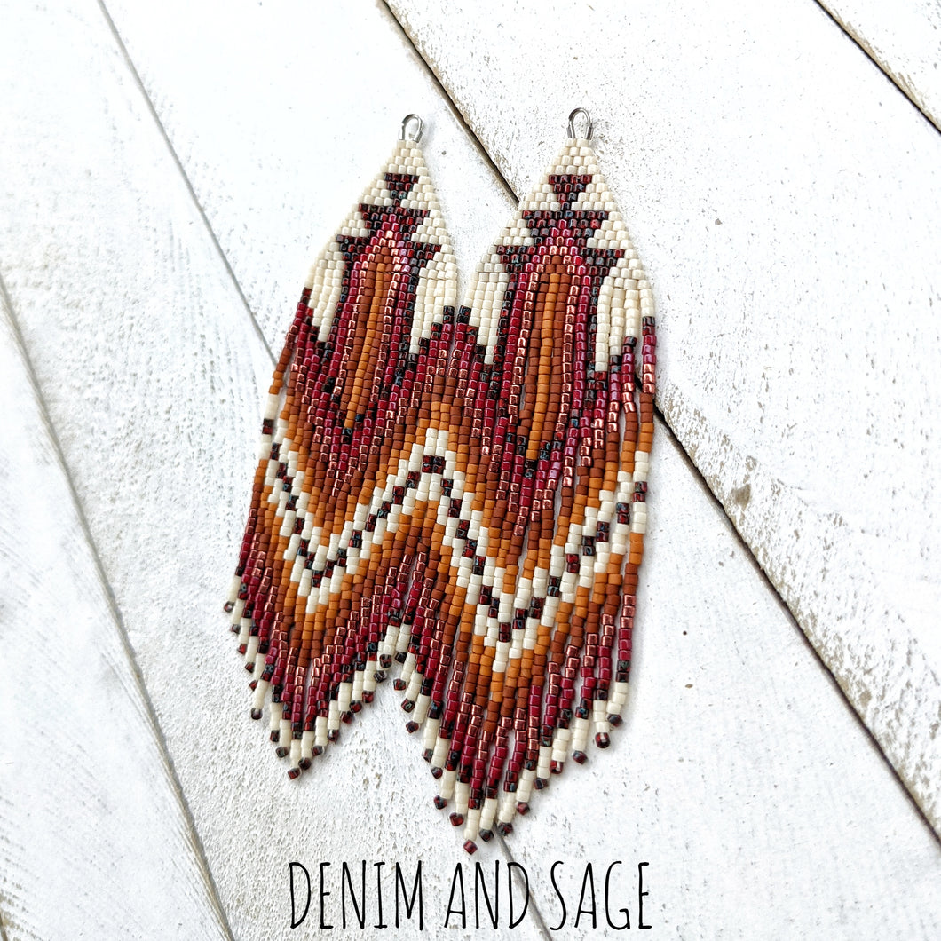 Dark red, burnt orange and cream beaded earrings. Indigenous handmade.